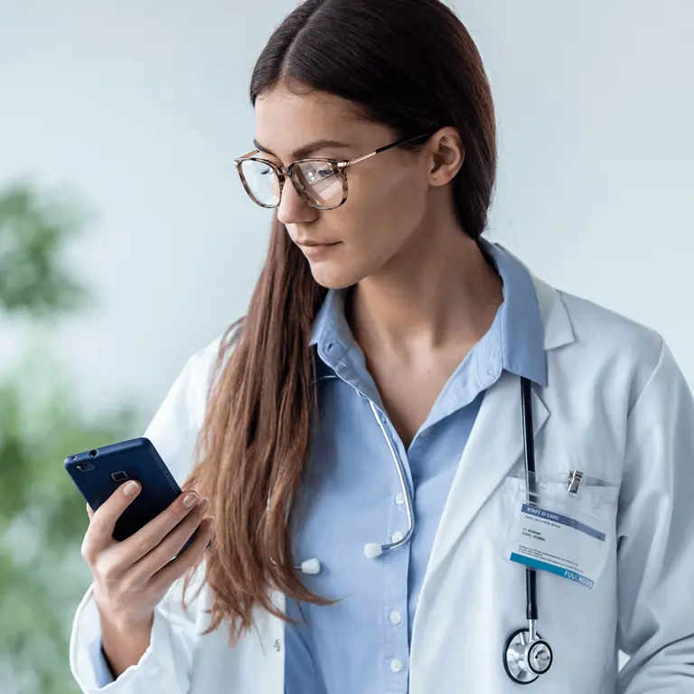Medical professional reviewing best practices on mobile app